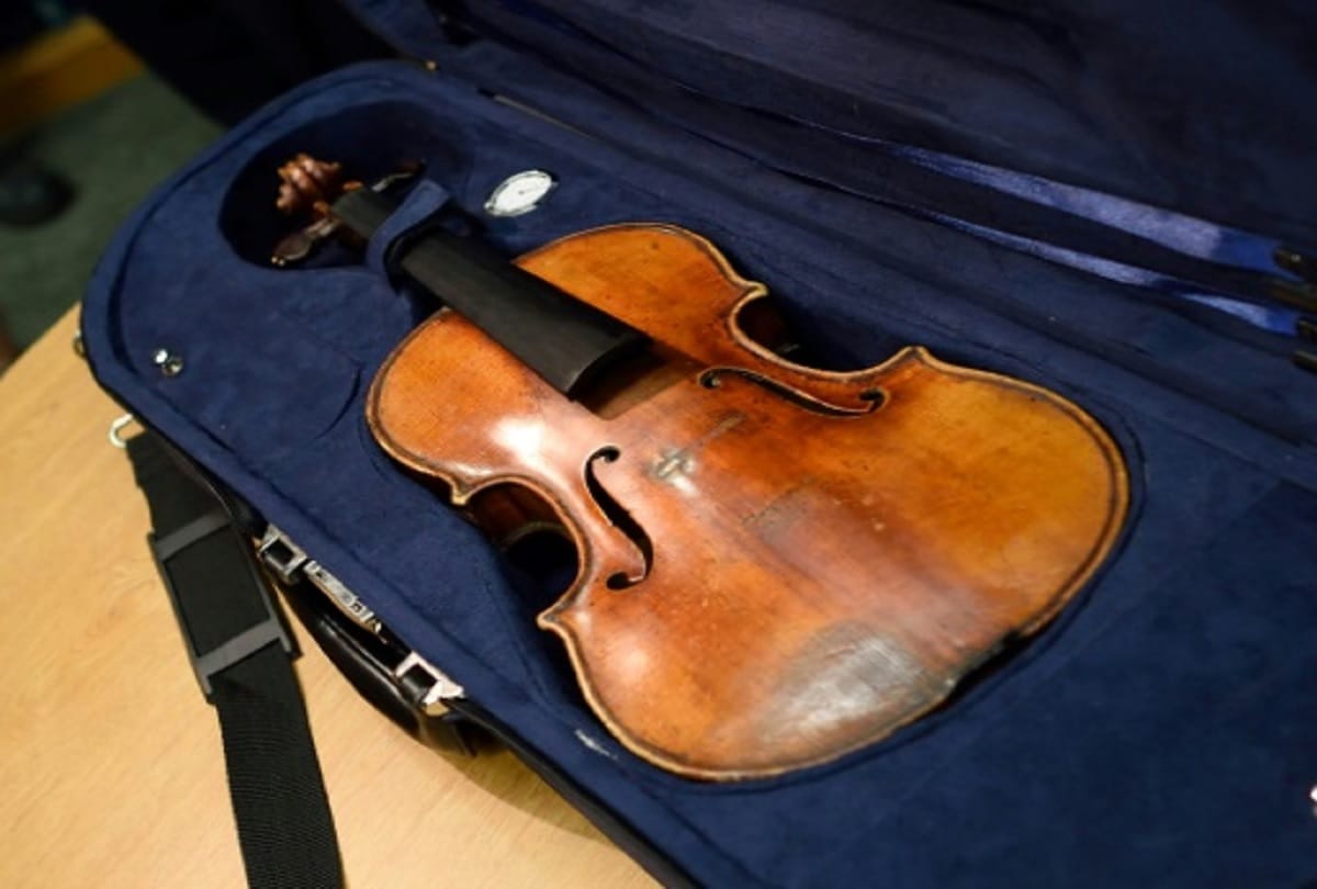 310 year old antique violin stolen from a train has been reunited with its owner