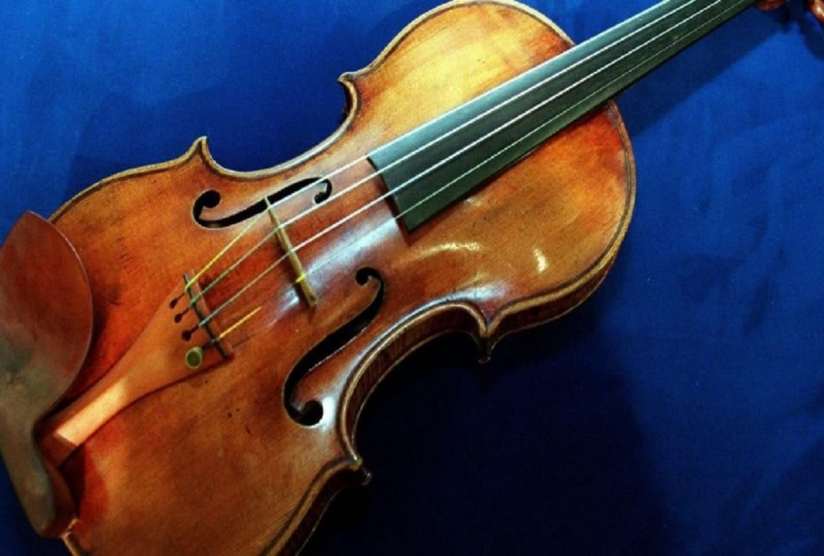 310 year old antique violin stolen from a train has been reunited with its owner