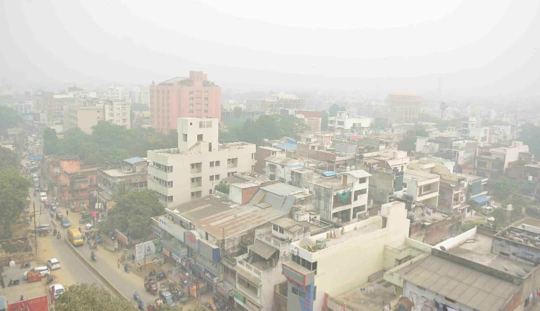 air pollution effects gods wear mask in Varanasi