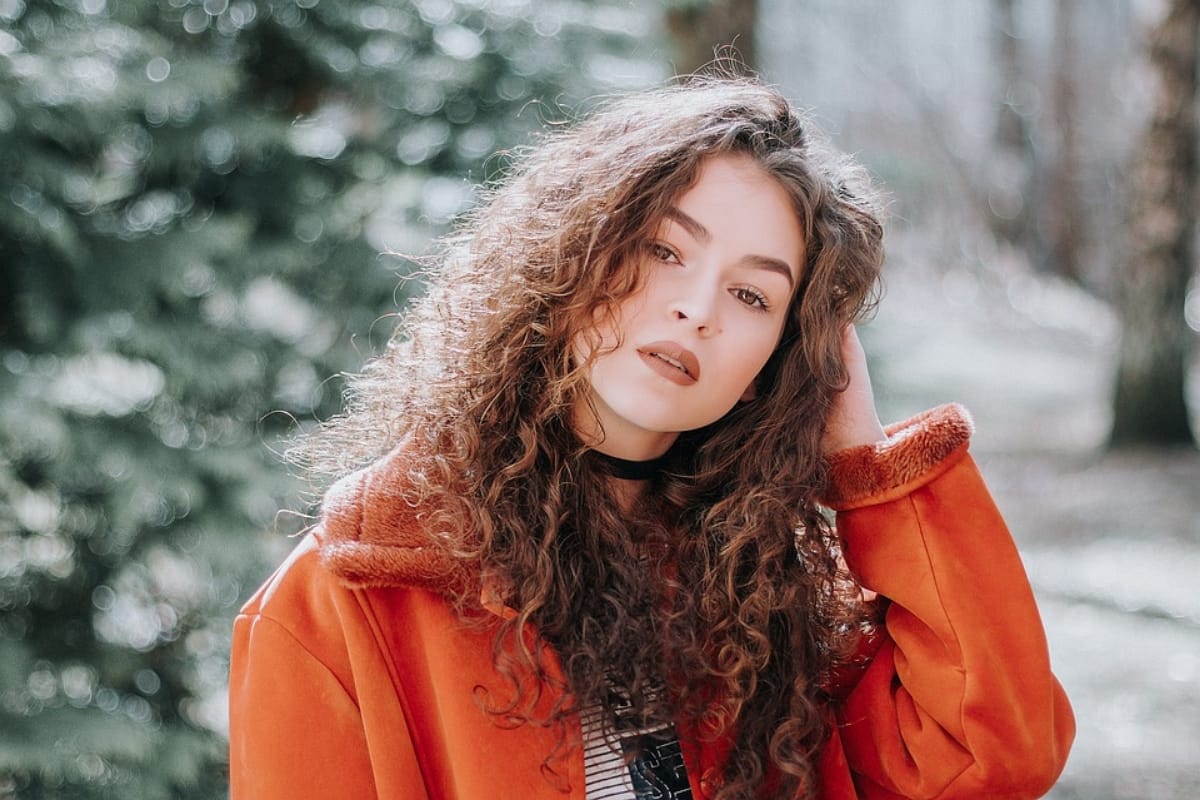 What is plopping technique and how does it benefit curly hair