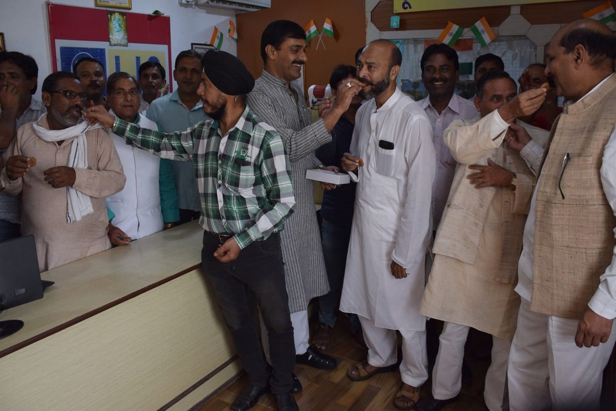 Welcome ayodhya verdict with sweets