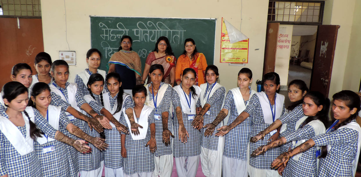 Girls show talent in Mehndi competition
