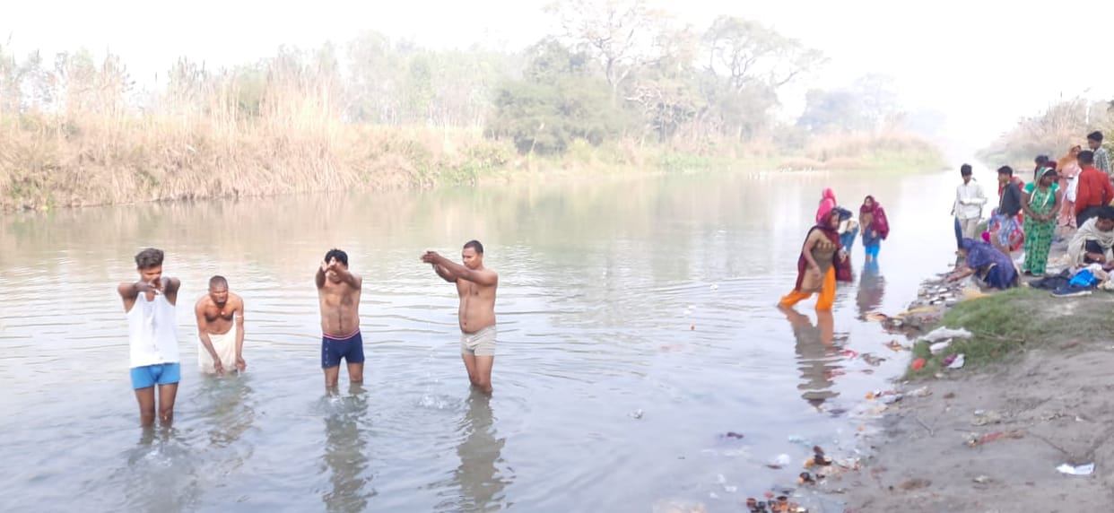 Earned merit by bathing and lighting a lamp at the Sangam