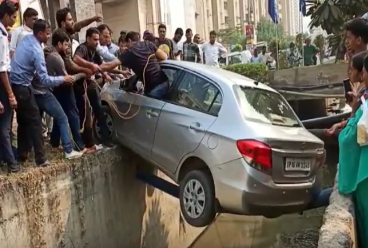 greater noida car swing on a pipe over drain for 35 minutes but driver saved video viral