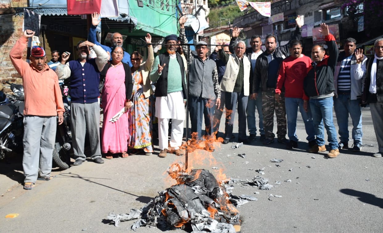 Government effigy lit