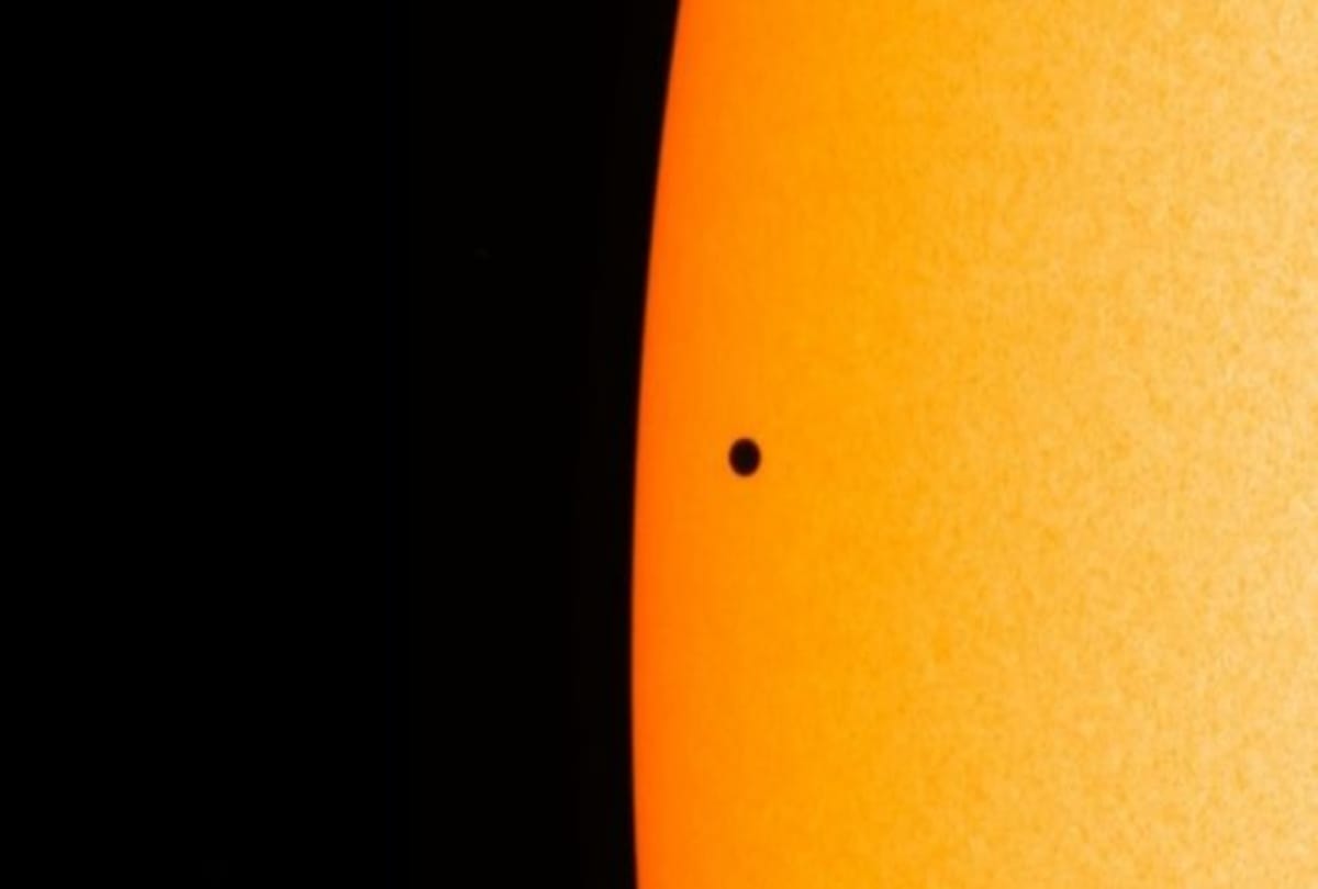 Rare astronomical event Planet Mercury passes across the face of the Sun looks like a mole