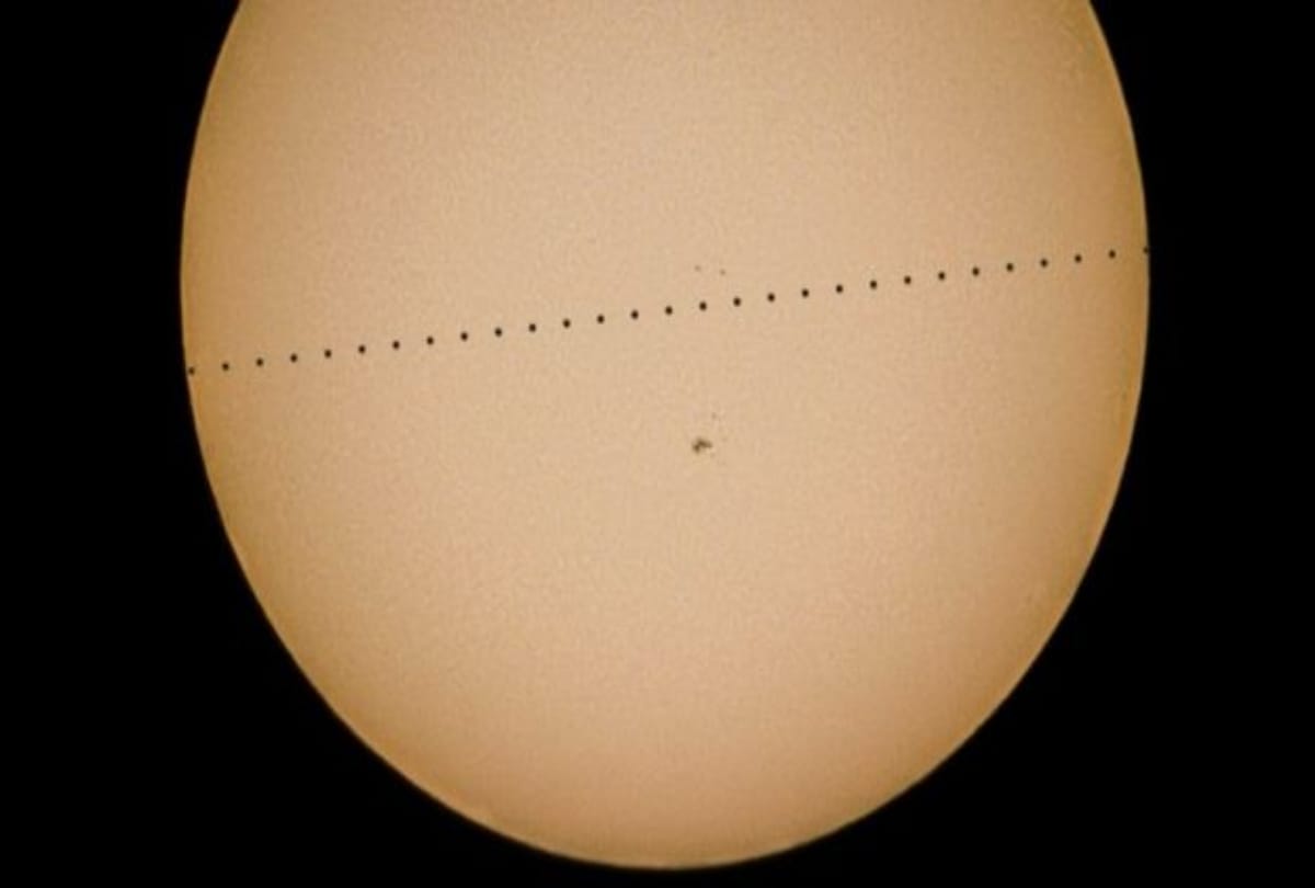 Rare astronomical event Planet Mercury passes across the face of the Sun looks like a mole