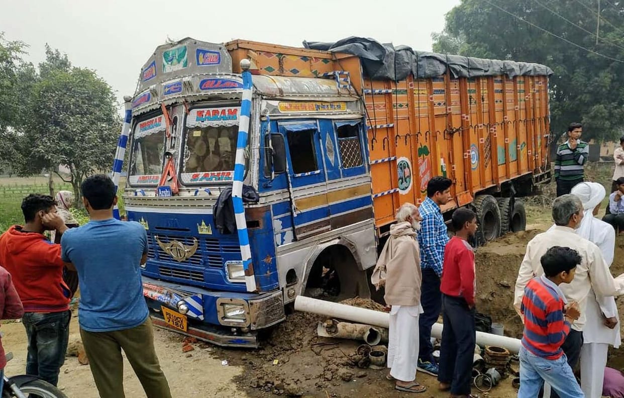 the truck trapped in hole, villegers are  worred