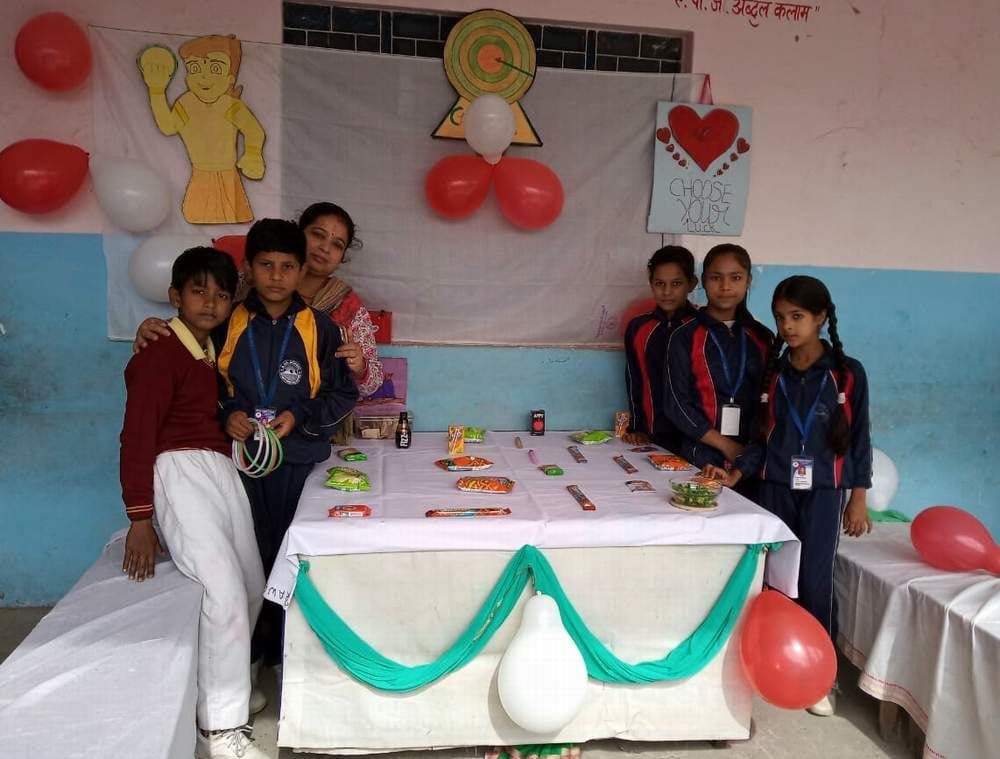 'Children contribute to the development of the country by reading and writing'