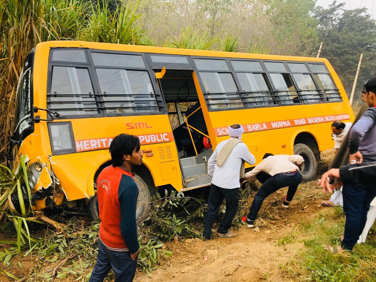 School bus slipped into farm due to loader collision