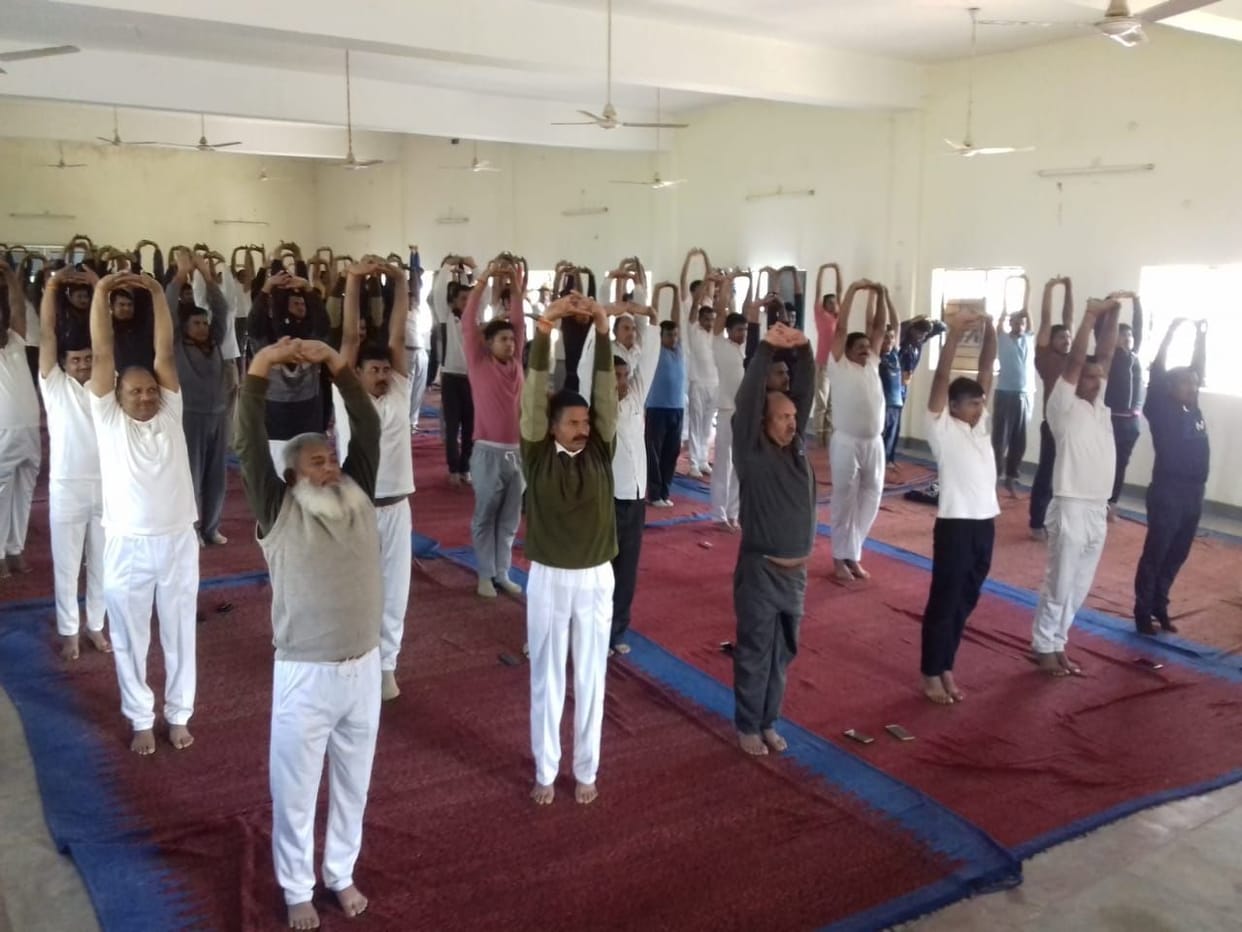 Police personnel doing yoga for fitness