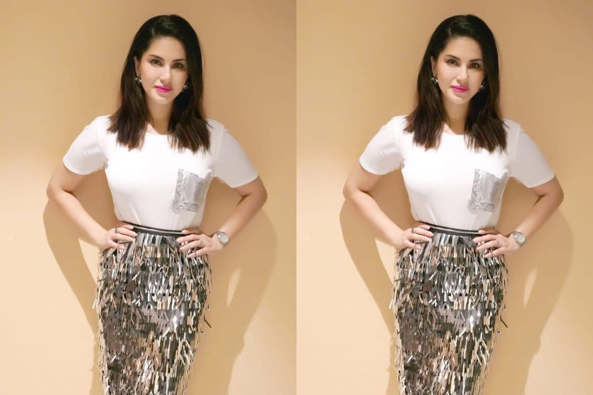 sunny leone rocks gorgeous casual look in shimmer skirt and white top