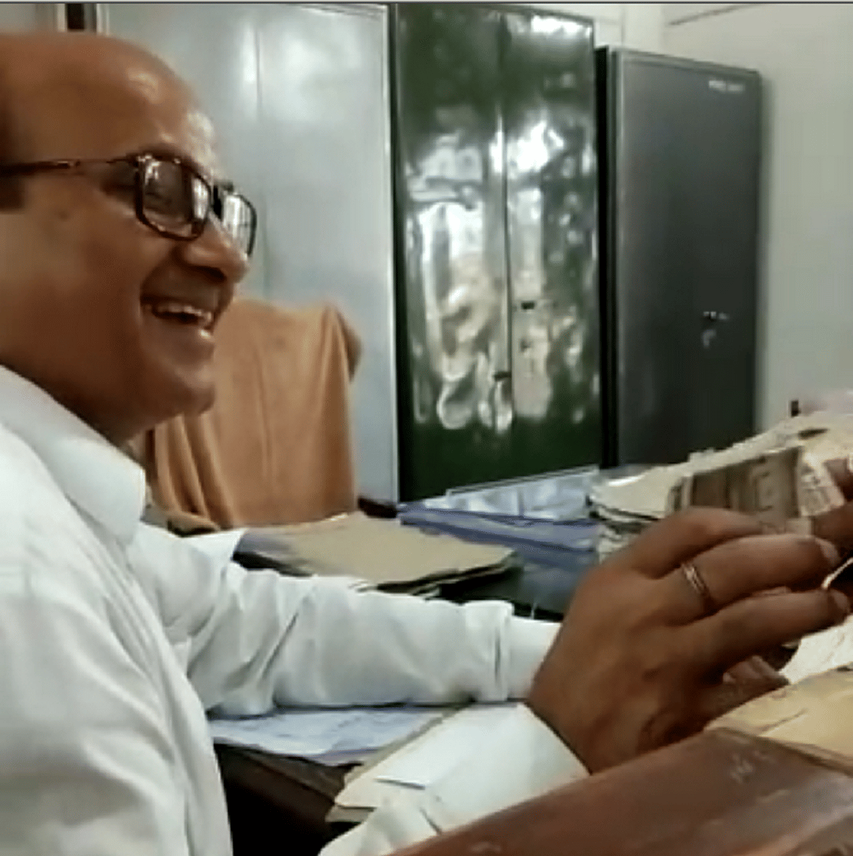 video viral of peshkar of sdm sadar to taking bribe in azamgarh