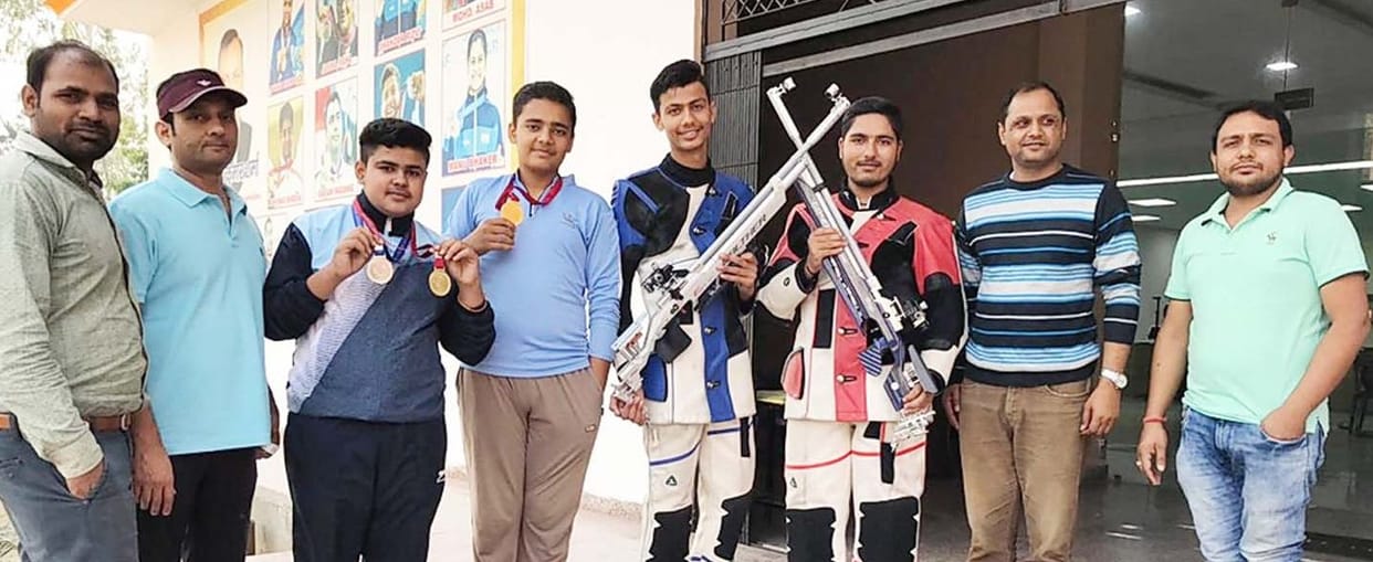 the shooter hold the medals