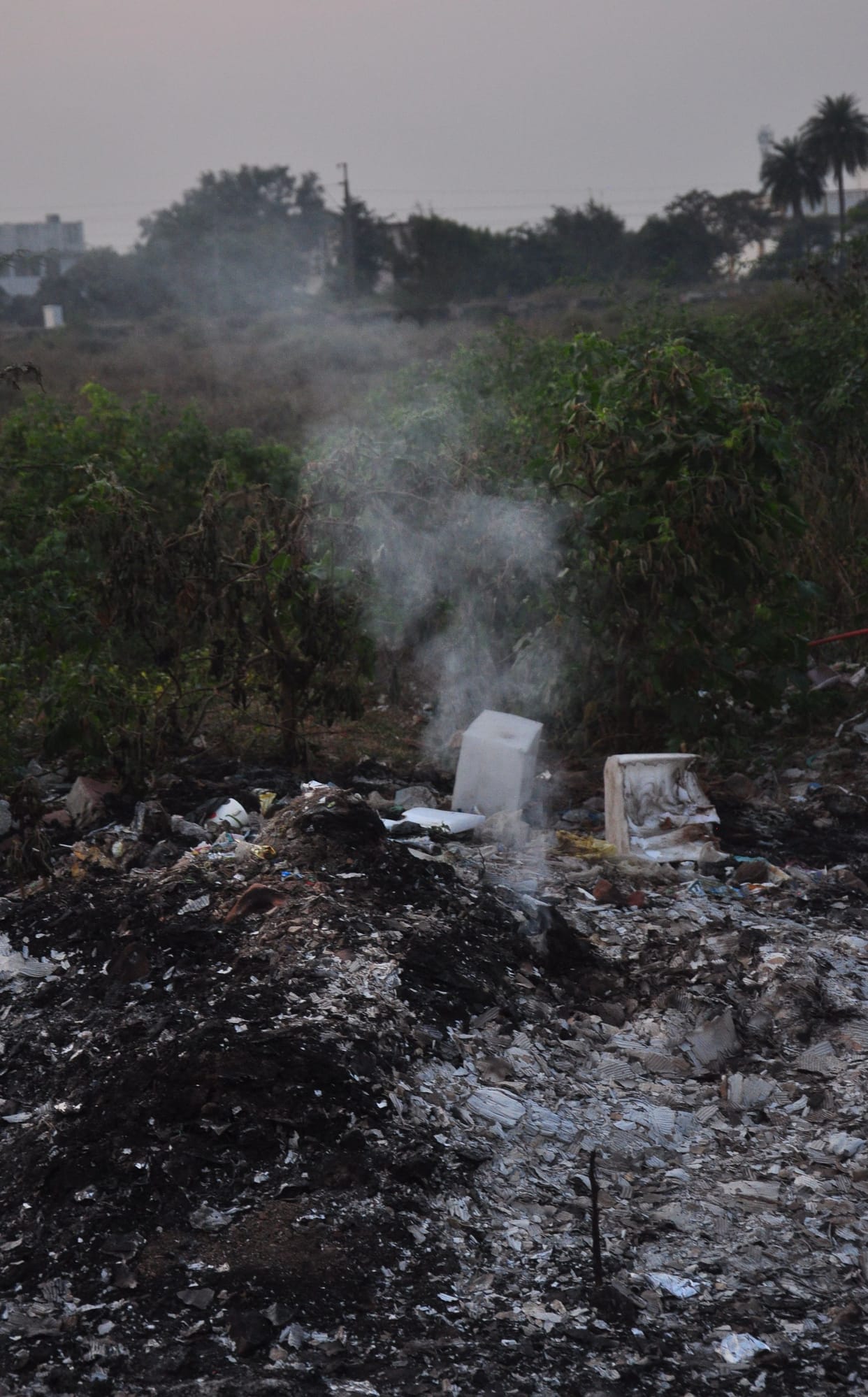 sue farmmers, burnning garbage openly