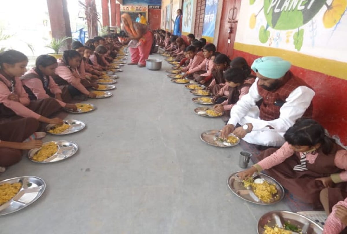 Minister sardar baldev singh aulakh checks the quality of mid day meal and ate food with children
