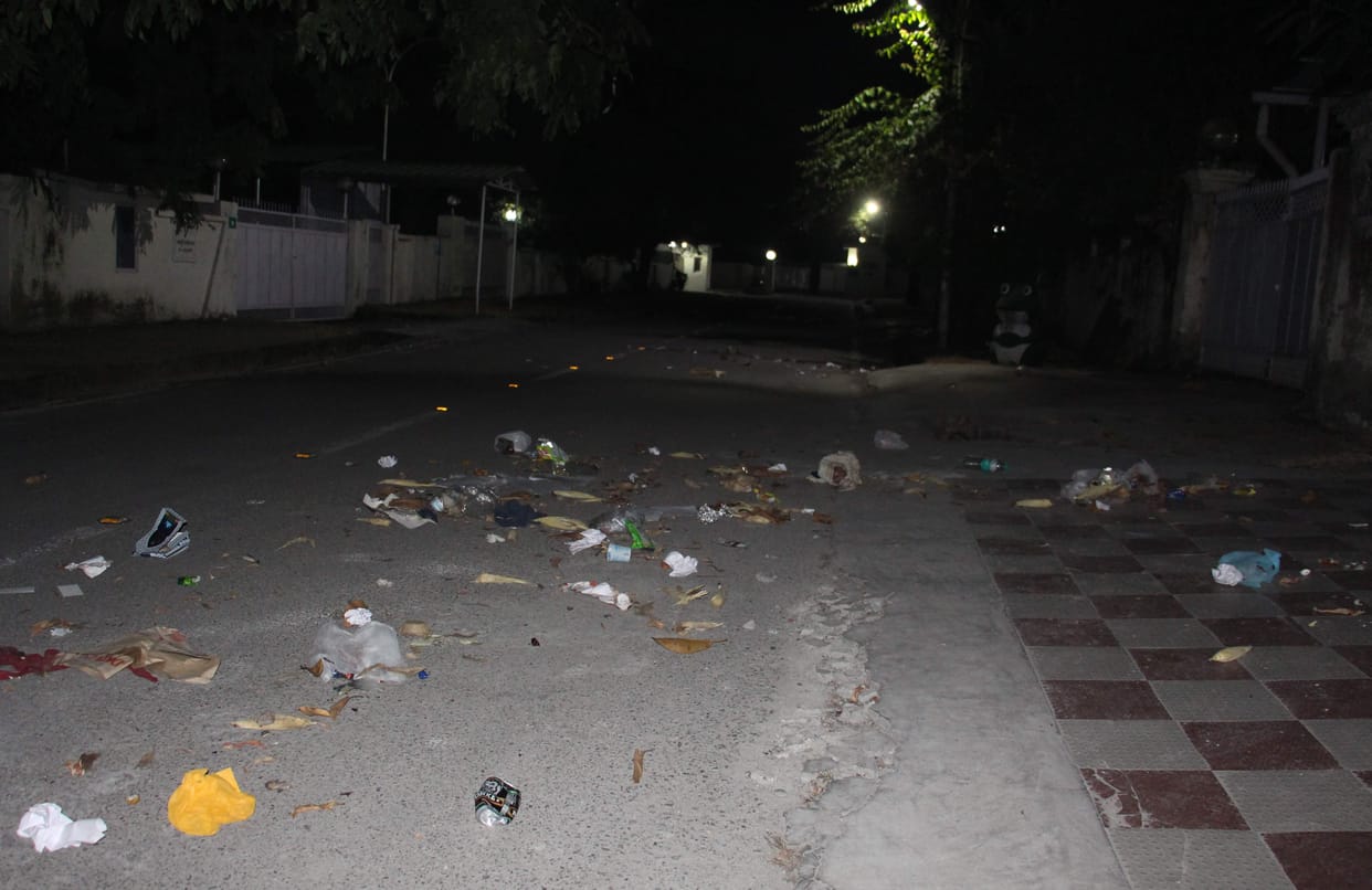 Scavengers spread garbage outside the ministers' residence