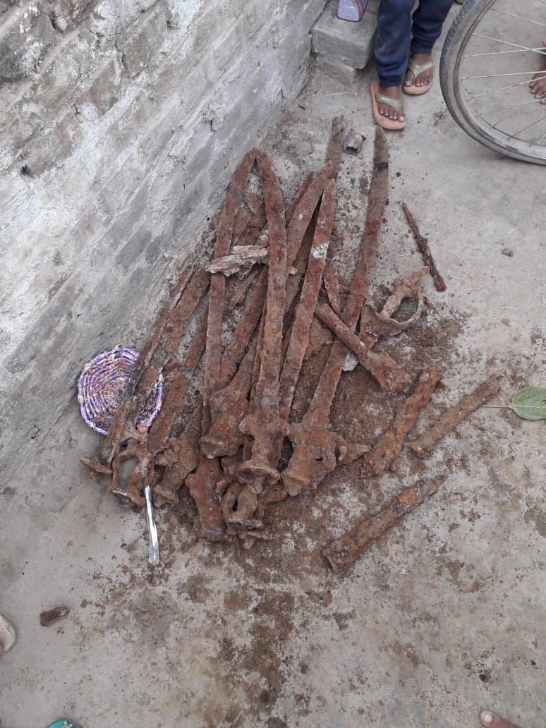 Old swords and gun drains found while digging the pit