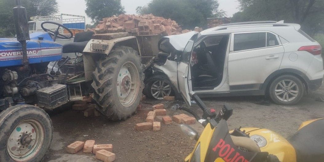 tractor, car, four injured