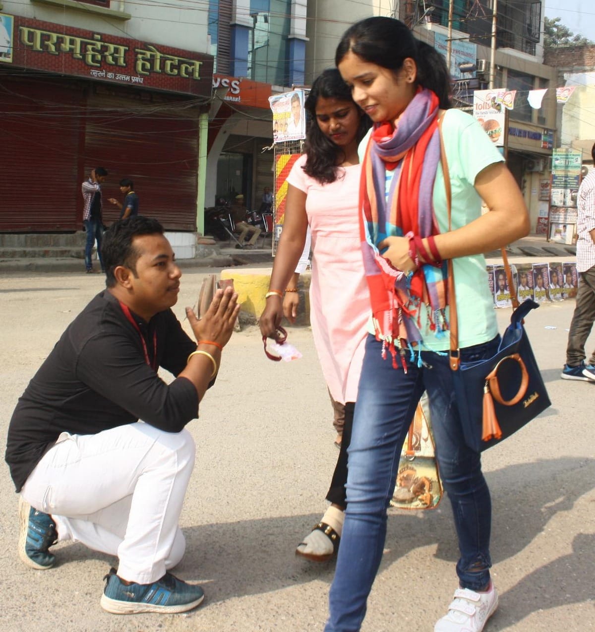 Kashi Vidyapeeth Student Union election candidate seeking votes folded hands in front of student