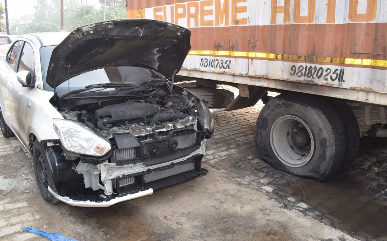 Car laden trola burnt up touching the HT line