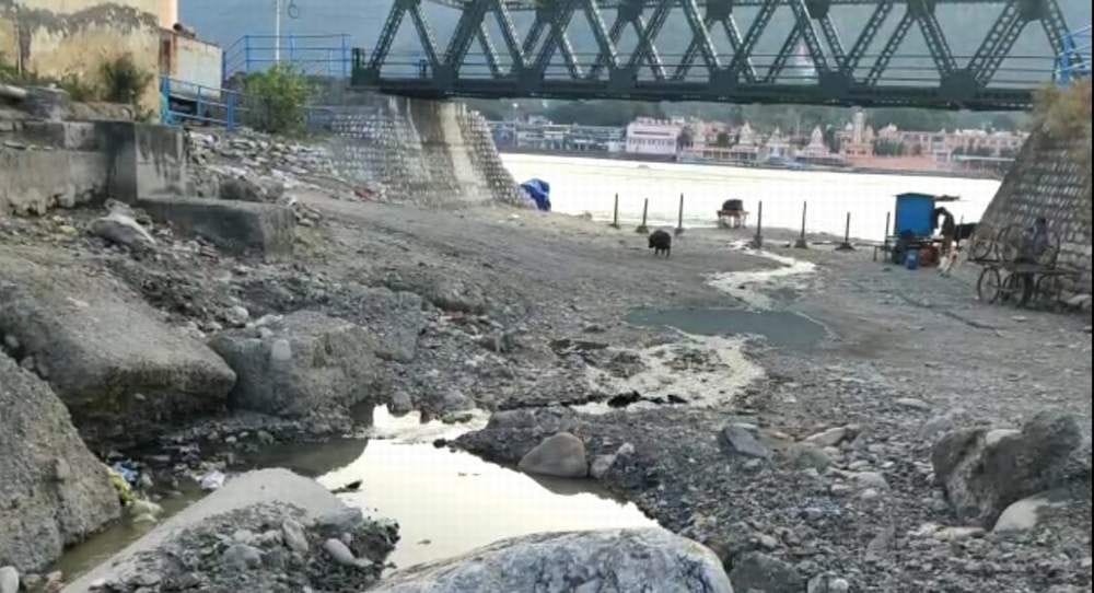 Dirty sewer water falling in the Ganges in Kharasroth region