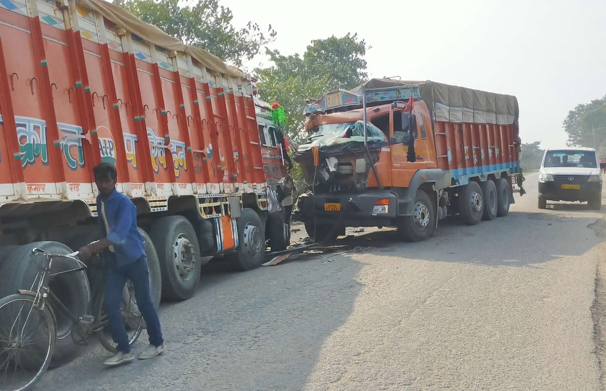 Second truck collided with standing truck, driver injured