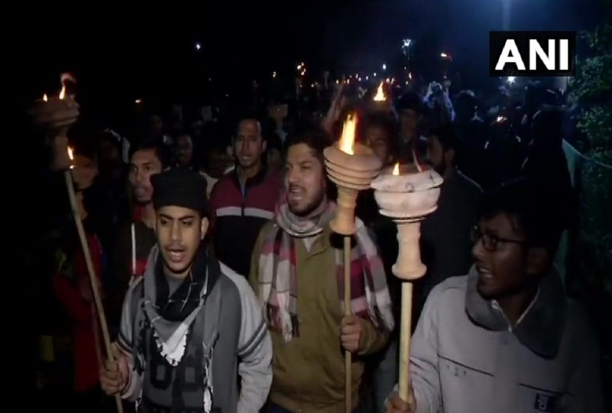  Students of JNU carry out a protest march with torches inside the University Campus