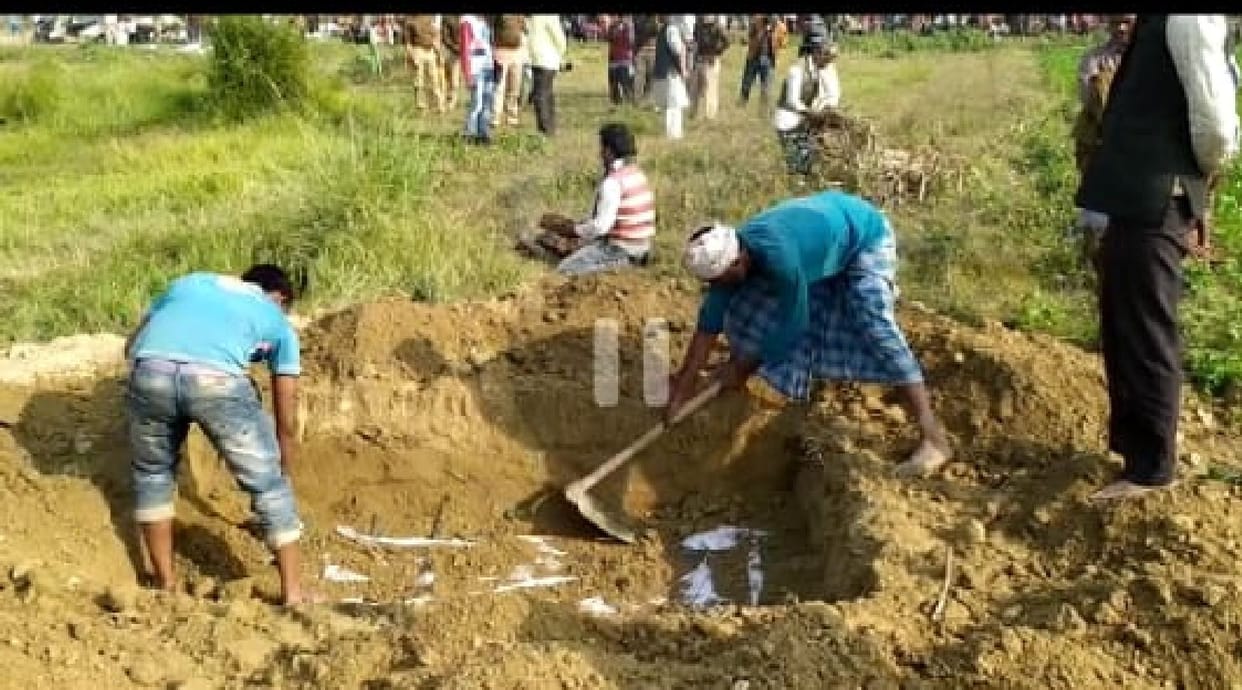 A month later the body of a woman was removed from the grave