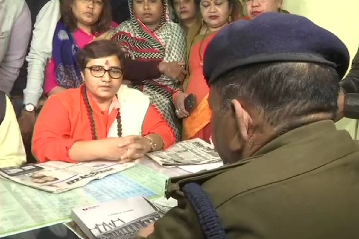 BJP MP Pragya Thakur on dharna against Congress MLA Govardhan Dangi outside police station in Bhopal