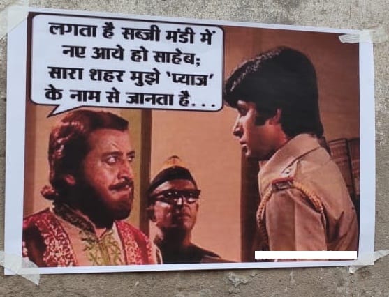 Protest against the rising price of onion showed through the poster in varanasi