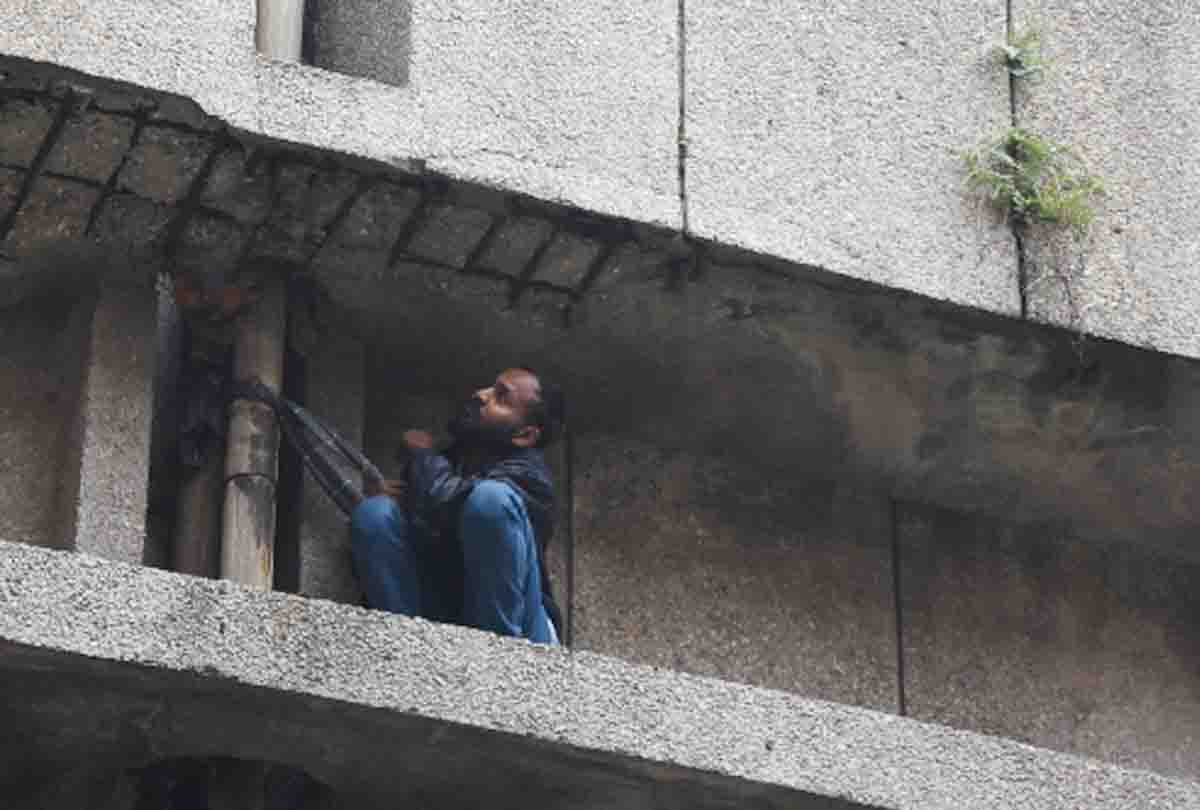 Husband of hospitalized woman created panic after climbing on roof in jammu kashmir