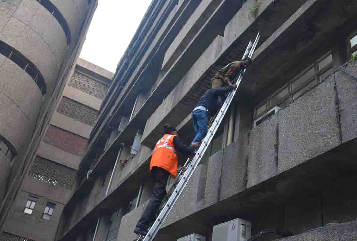 Husband of hospitalized woman created panic after climbing on roof in jammu kashmir