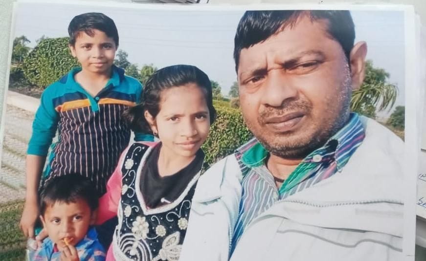 a man through his son and daughter in canal