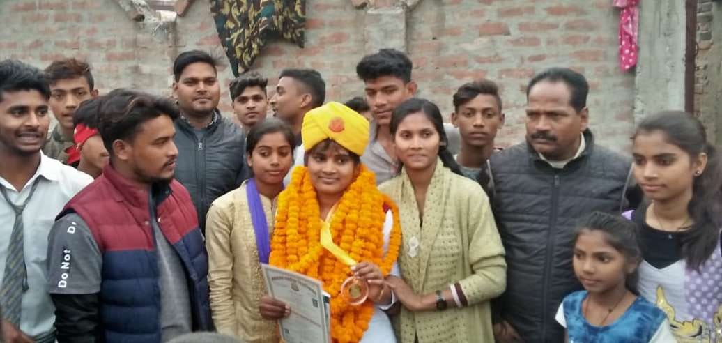 The villagers welcomed the gold medalist daughter
