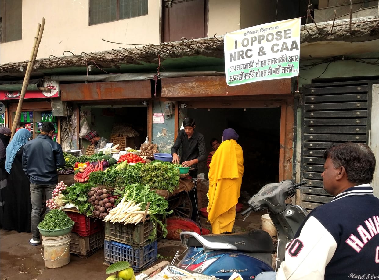 market with protesting poster
