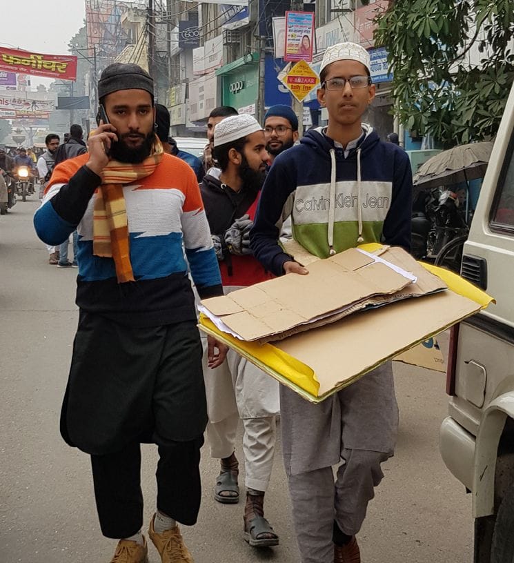 CAA: Students tore the banner in Muzaffarnagar
