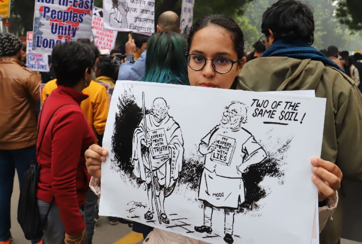 CAA protest creative slogans attract people after hearing national anthem protesters disperse