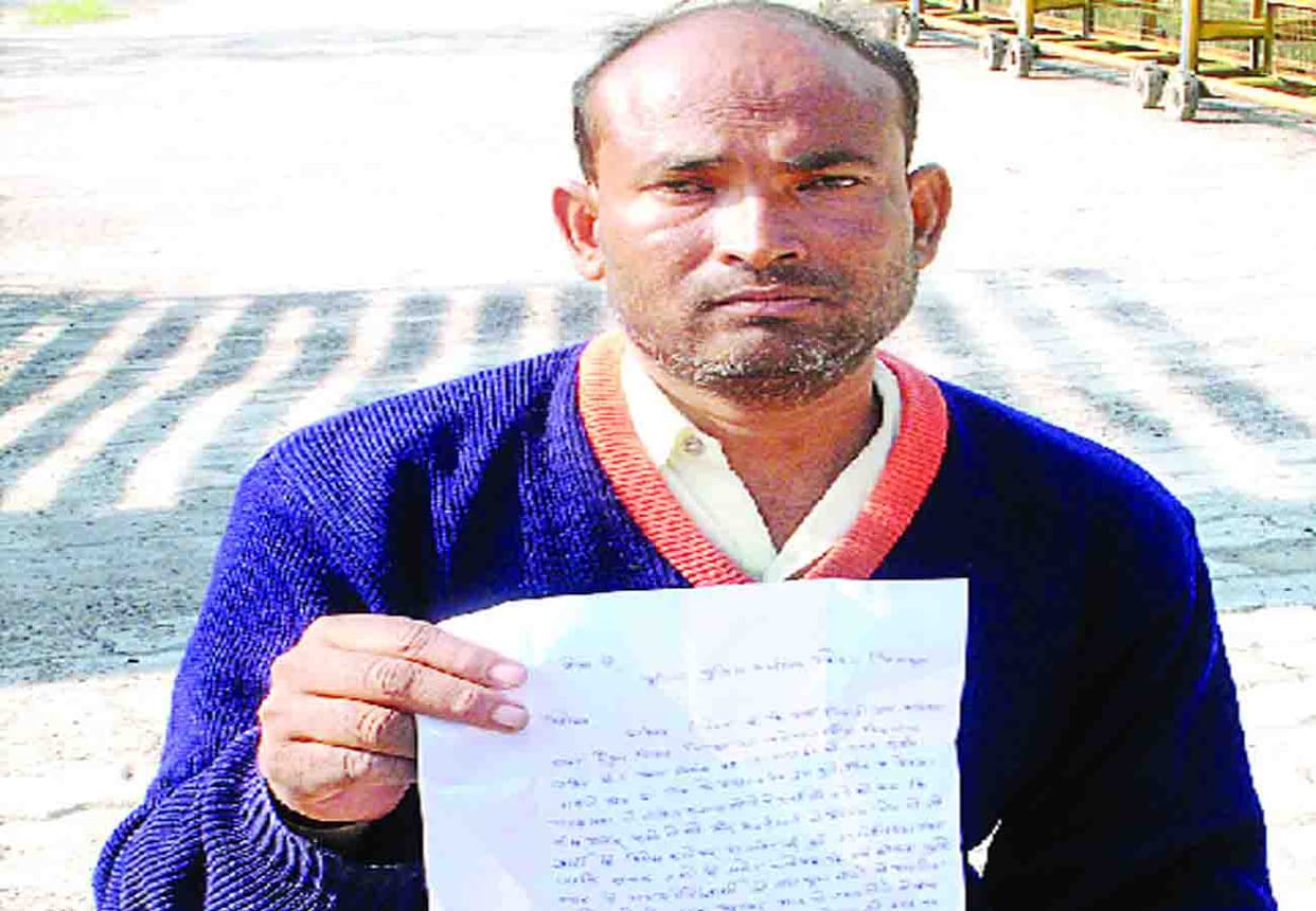 threatens self-immolation for not taking action on village head and others in SP office