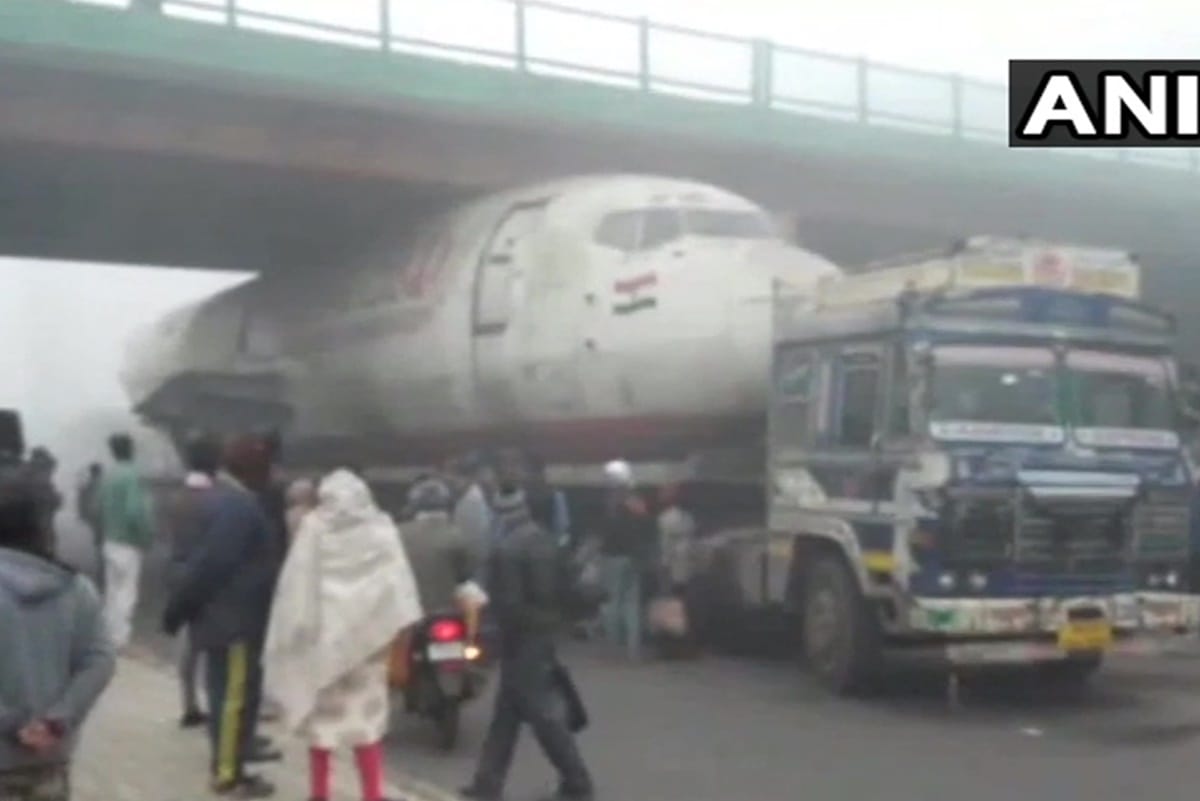 West Bengal truck carrying abandoned India Post aircraft got stuck under bridge in Durgapur