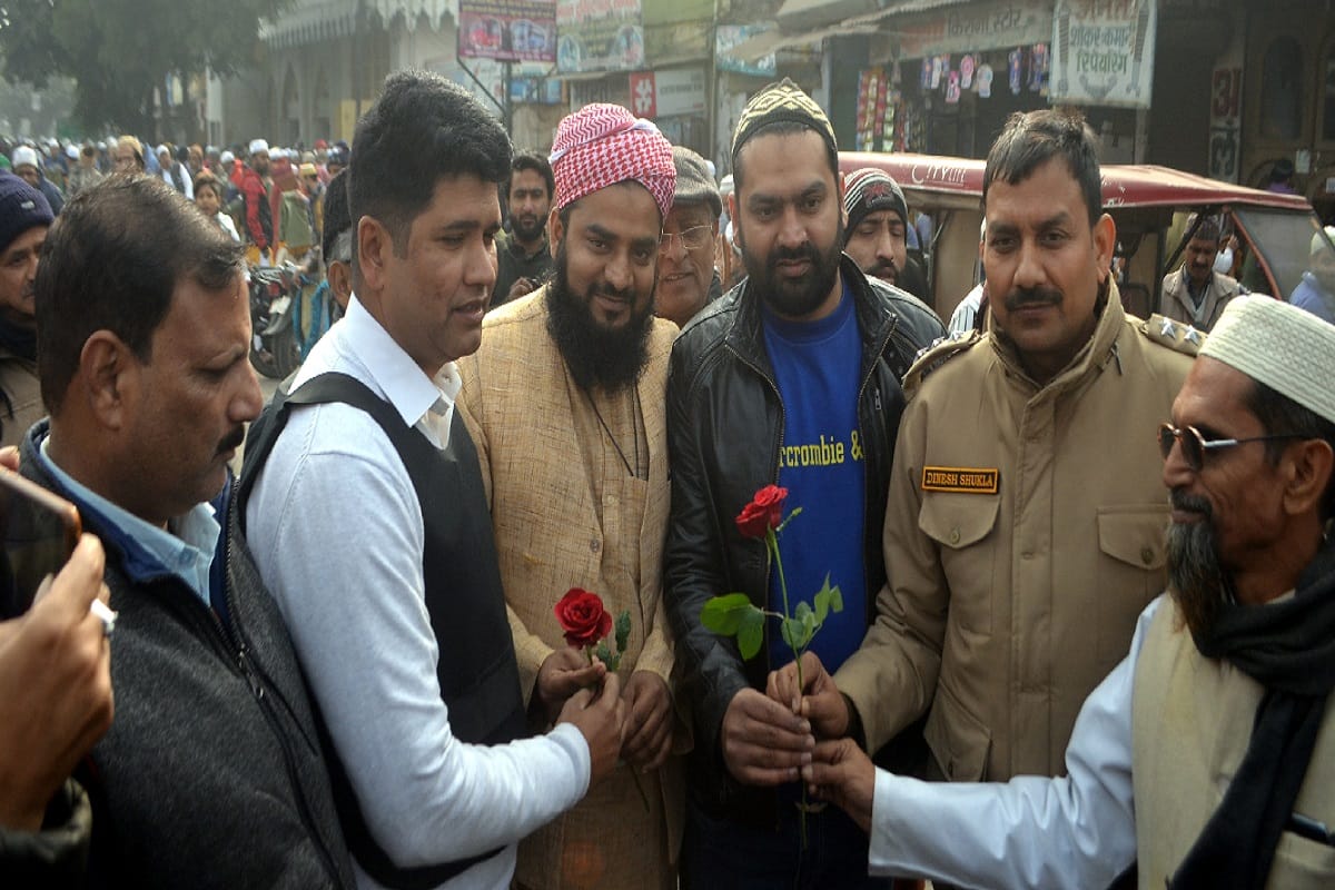 Police officials have distributed flowers to Muslim people on the Namaz after the violence in Meerut