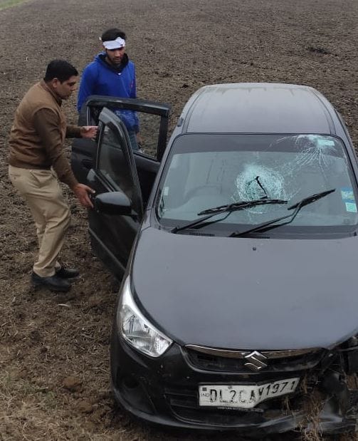 car overturned in field