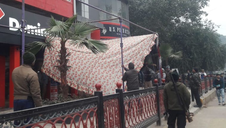 Domino Pizza removed from front, seized goods including tents