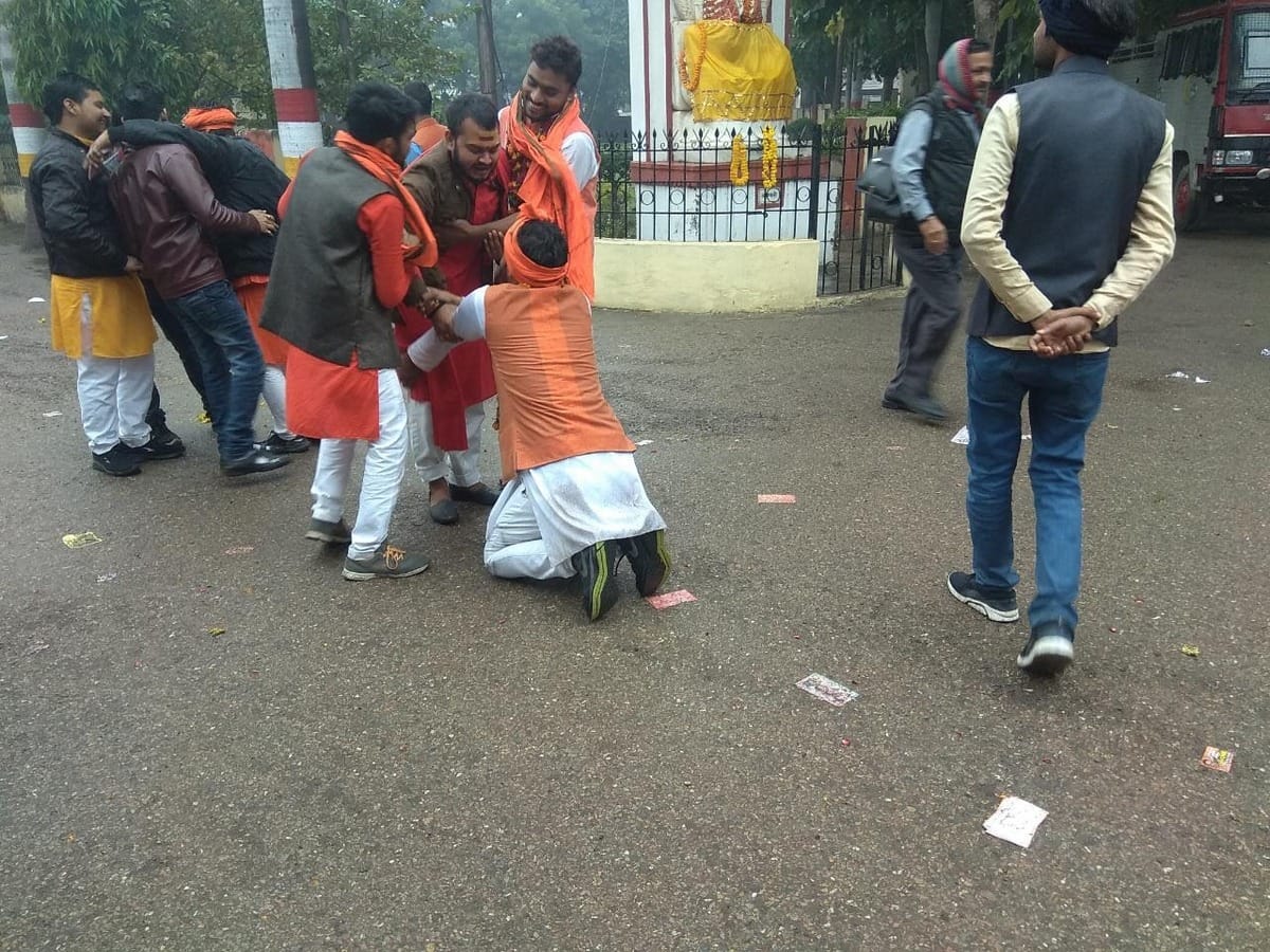Sampoornanand University Student Union election candidate seeking folded hands in front of student