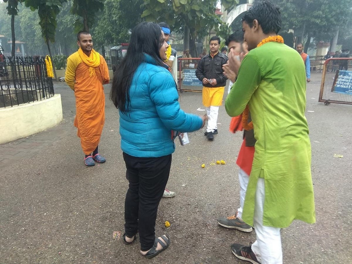 Sampoornanand University Student Union election candidate seeking folded hands in front of student