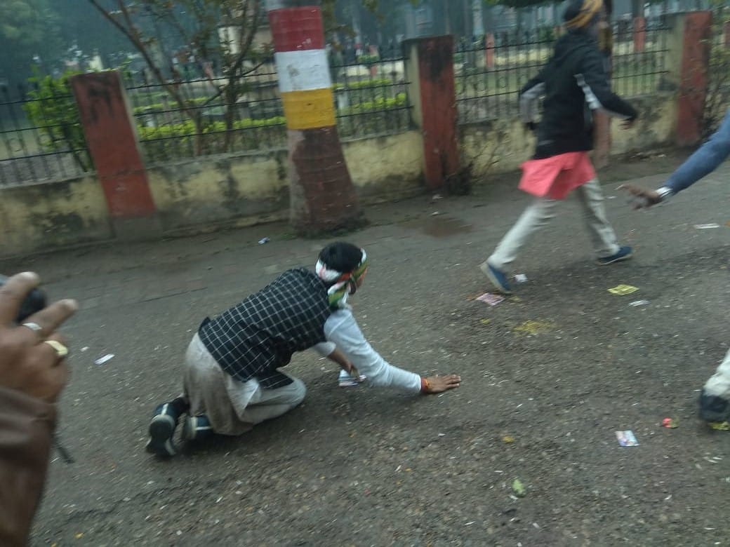 Sampoornanand University Student Union election candidate seeking folded hands in front of student