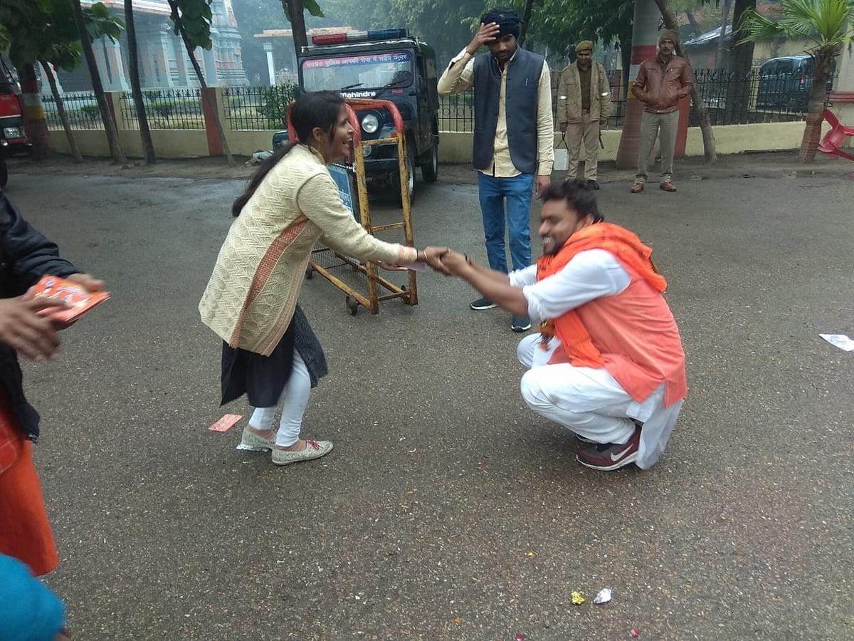 Sampoornanand University Student Union election candidate seeking folded hands in front of student