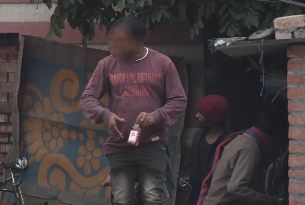 alcoholics are openly drinking liquor on the road
