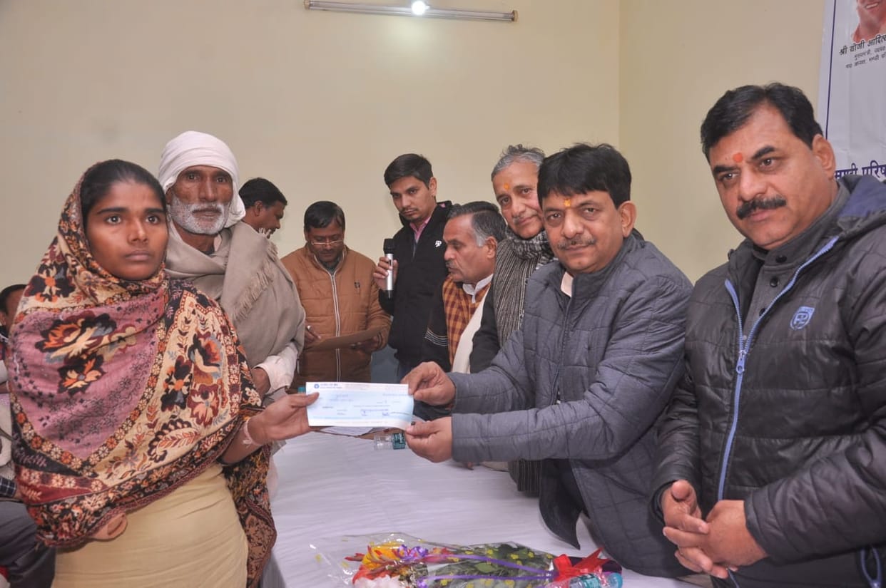 Accident insurance check to farmers, tarpaulin distributed to traders
