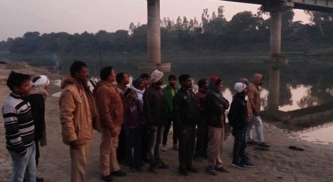 Villager taking bath at Ibrahimpur Ghat immersed in Gomti River